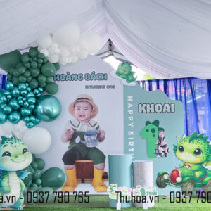 Trang trí thôi nôi bé Hoàng Bách chủ đề Rồng xanh lá